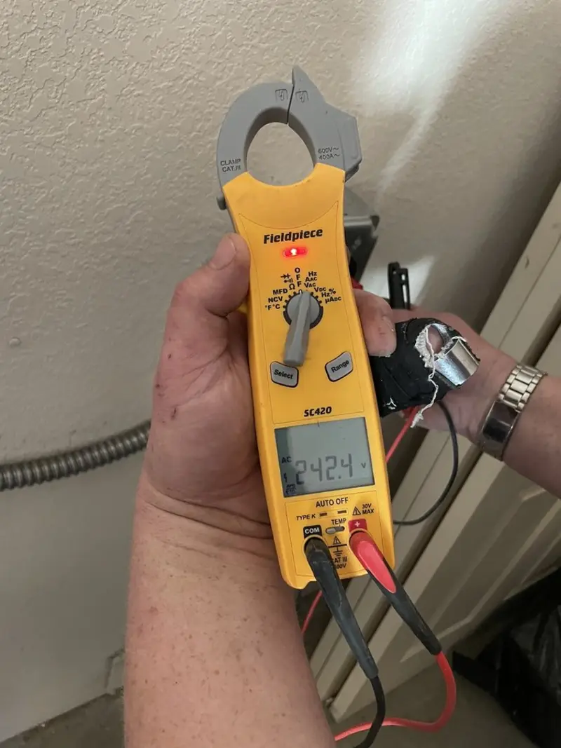 Voltage testing with clamp meter during Electrical Installation Services in Plainwell